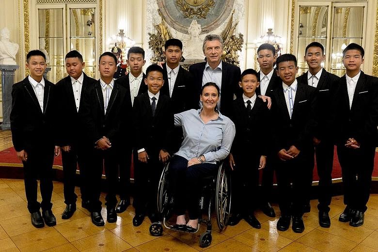 Thai football team Wild Boars with Argentinian President Mauricio Macri (standing) and Vice-President Gabriela Michetti (seated) on a visit to Buenos Aires last month. The Cave, Nang Non is slated for release next year.