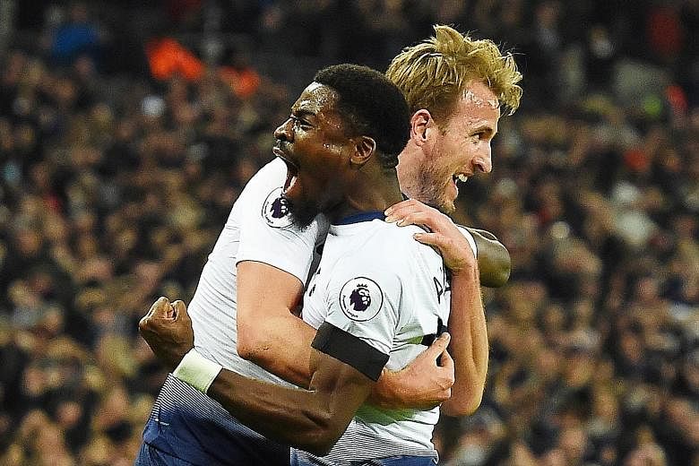 Harry Kane celebrating with Serge Aurier after the Englishman put Tottenham 2-0 up against Chelsea at Wembley on Saturday. The 3-1 loss was Chelsea's first in the league this season, as Spurs moved above them into third place.