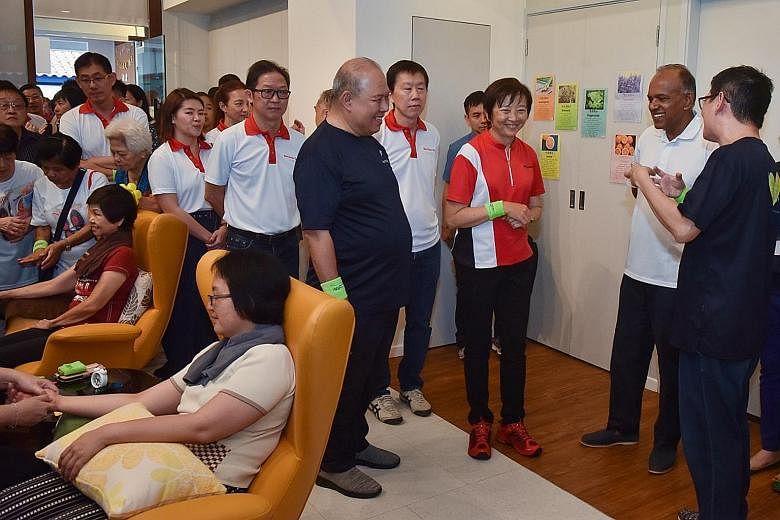 Home Affairs and Law Minister K. Shanmugam touring the GoodLife!@Yishun centre with Nee Soon GRC MP Lee Bee Wah (in red shirt) and Brother Dominic Yeo Koh (next to her in dark-coloured shirt), who sits on the board of directors of Montfort Care, whic