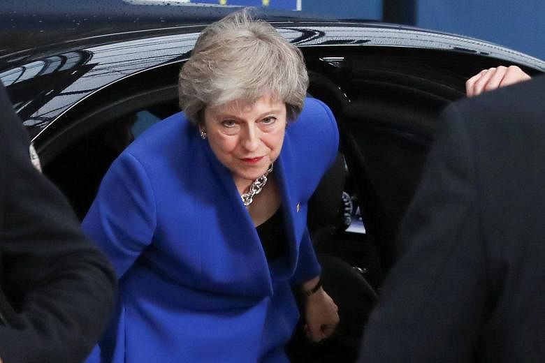 British Prime Minister Theresa May arriving at the EU leaders' summit in Brussels yesterday. The Brexit deal she signed is hated by those who want Britain out of the EU as it ties the British to the Union for years to come. But the deal is also hated