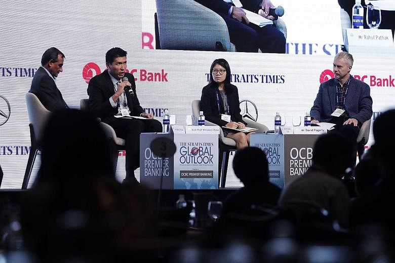 (From left) Moderator and ST associate editor Rahul Pathak, Assistant Professor Winston Chow of the National University of Singapore, Assistant Professor Lynette Cheah of the Singapore University of Technology and Design, and ST assistant foreign edi