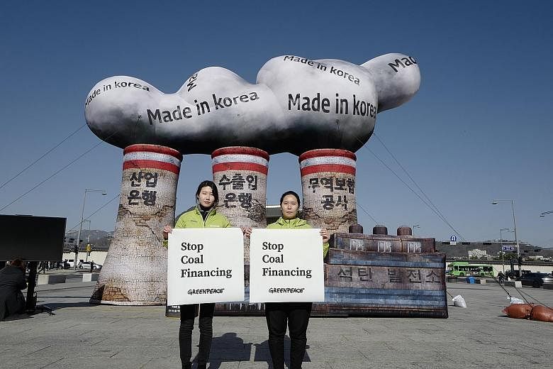 Greenpeace activists in Seoul protesting against the use of coal. The new EU strategy does not propose changing its 2030 goal, but it sets seven building blocks for the following decades that could be turned into binding targets.