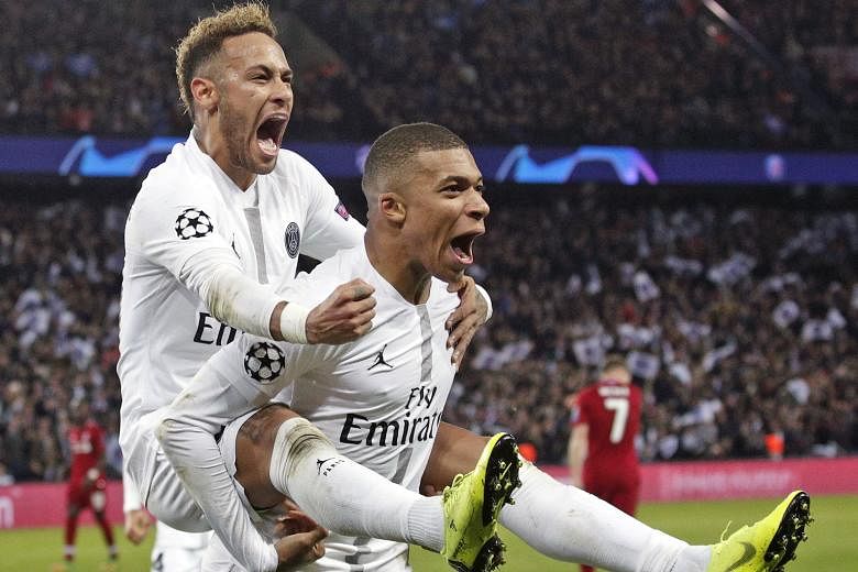 Paris Saint-Germain's Neymar (left) celebrating with Kylian Mbappe after scoring in their 2-1 win over Liverpool. The Brazilian repeatedly went down at the slightest of contacts to break up the game's flow.