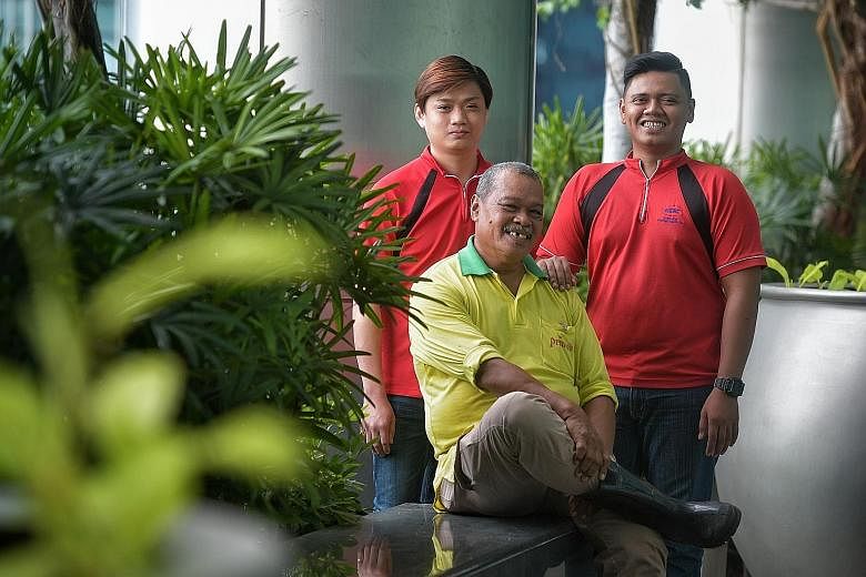 Landscape technician Md Yasin Ithnin (centre) from Prince's Landscape and Construction has seen his basic pay rise from $1,300 to $1,550 now. With him are Mr Jarren Teo, assistant landscape supervisor, and Mr Muhammad Ridduan Sarman, landscape techni
