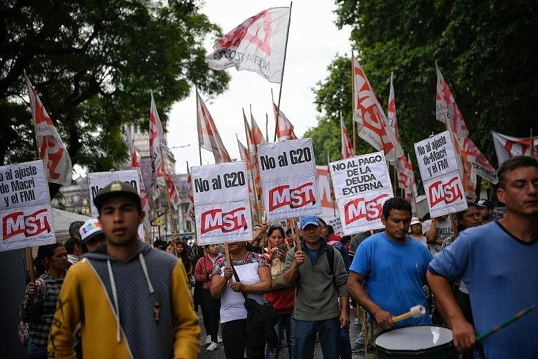 Supporters of the Workers' Socialist Movement protesting in Buenos Aires on Thursday ahead of the G-20 Leaders' Summit. The Global Governance Group, an informal group of 30 smaller states, said it welcomes recent efforts by the G-20 to uphold the rul