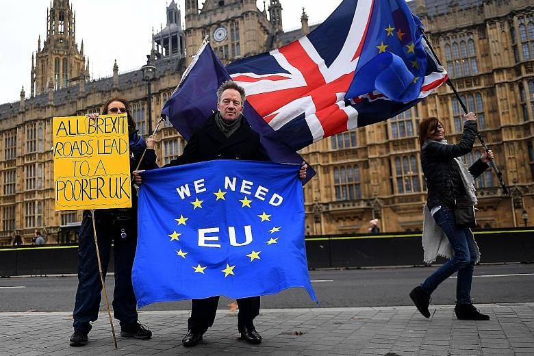 Pro-EU protesters making their stance known outside Parliament in London on Thursday. British MPs are set to vote on Prime Minister Theresa May's EU Brexit deal on Dec 11.