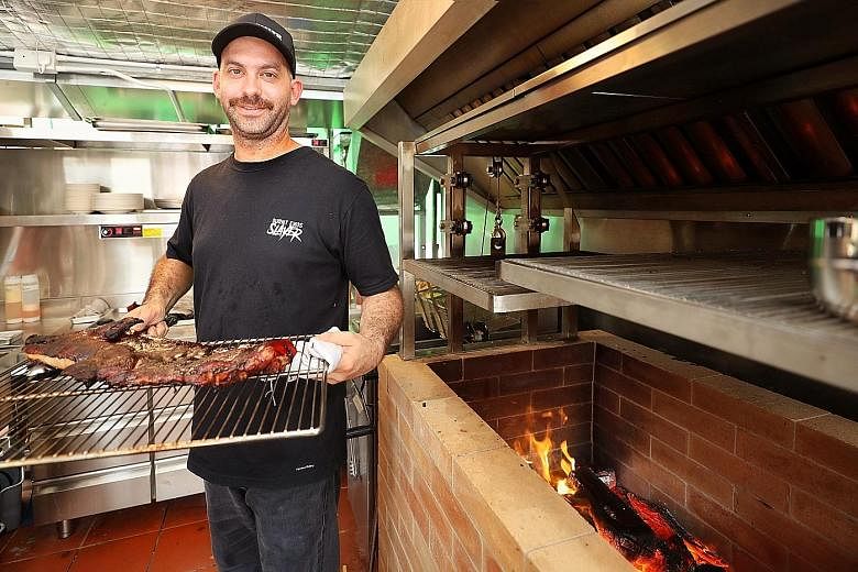 Chef David Pynt's Meatsmith Western BBQ will serve barbecue dishes, including smoked suckling pig, cooked in a brick grill fired with jarrah, an Australian hardwood.