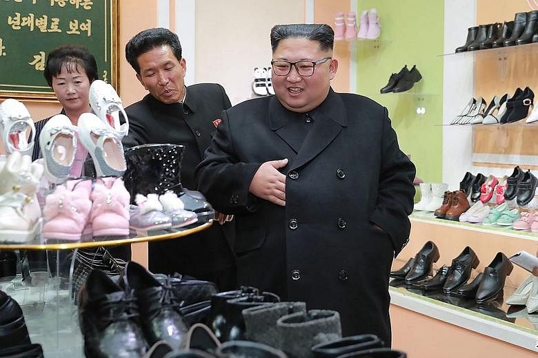 An undated picture released yesterday showing North Korean leader Kim Jong Un visiting a shoe factory in the country.