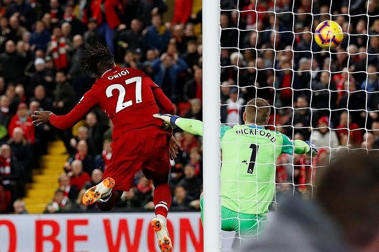 Forward Divock Origi scoring the winner in Liverpool's 1-0 derby victory over Everton at Anfield on Sunday. The bizarre strike prompted Reds manager Jurgen Klopp to run onto the pitch in unbridled celebration.