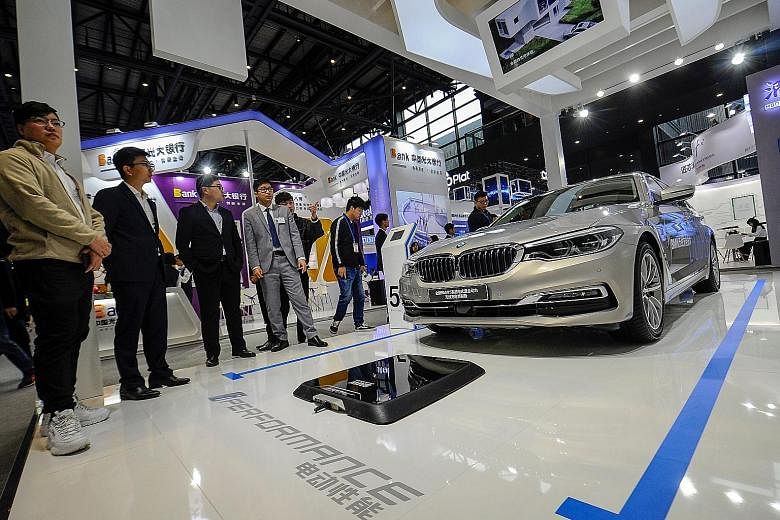 A BMW electric car at the Light of Internet Expo ahead of the 5th World Internet Conference in Wuzhen in China's Zhejiang province last month. A reduction or removal of auto tariffs would be a potential boon for automakers like Tesla and BMW which ma