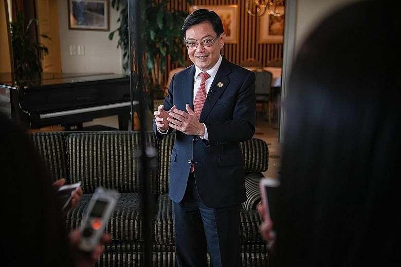 Finance Minister Heng Swee Keat speaking to reporters on Saturday after the end of the G-20 summit. He said the 4G ministers will examine the fundamental, long-term issues that Singapore needs to address.