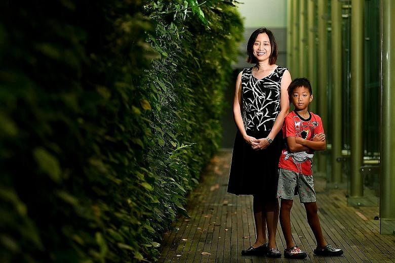 Teacher Er Siew Shin, 39, and her eight-year-old son, Goh Yun Wen, a Primary 2 pupil, at the National Gallery Singapore yesterday. Ms Er has been a Gusto mum since 2009. Gusto was started in October 2008 to study how conditions in pregnancy and early