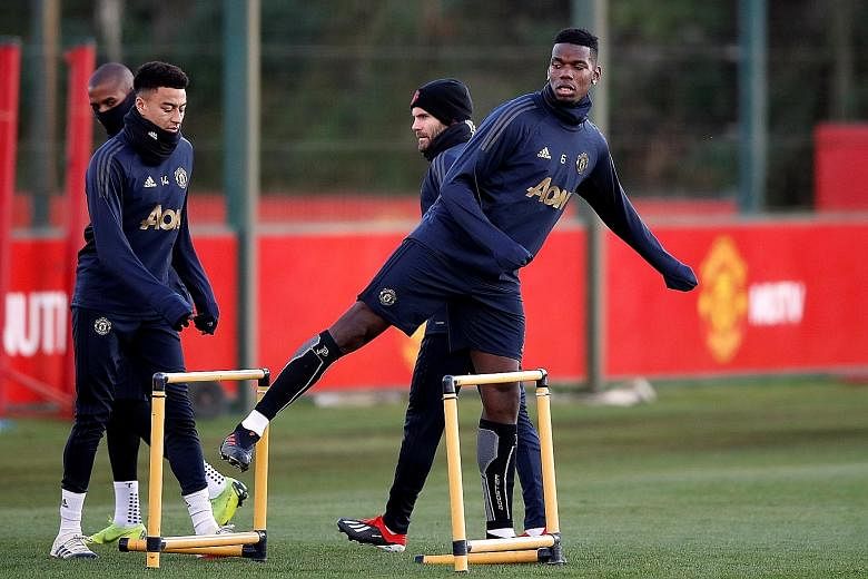 United's Paul Pogba, with Jesse Lingard (far left) and Juan Mata in training. Manager Jose Mourinho has not held back in his criticism of his underachieving players in recent weeks.