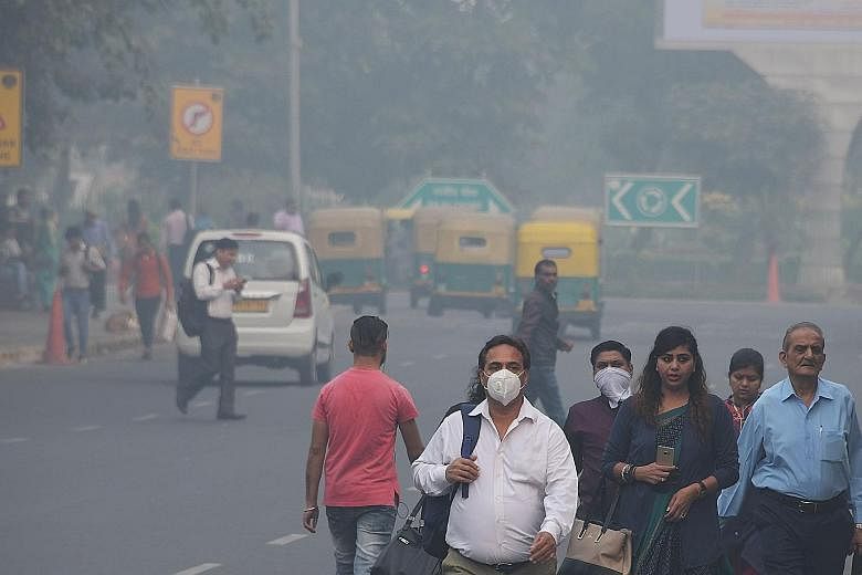 A smog-covered street in New Delhi. Each winter, Delhi's levels of airborne pollutants routinely eclipse safe limits.