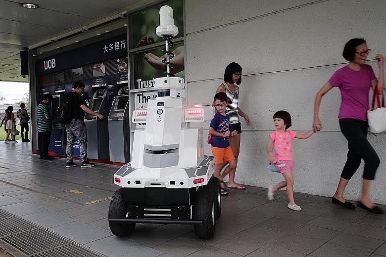 The robot deployed by LTA during Exercise Station Guard at Hougang MRT station yesterday. Developed by ST Engineering, it is equipped with seven cameras to give it a 360-degree view, and has GPS and other sensors. The robot's control console was loca