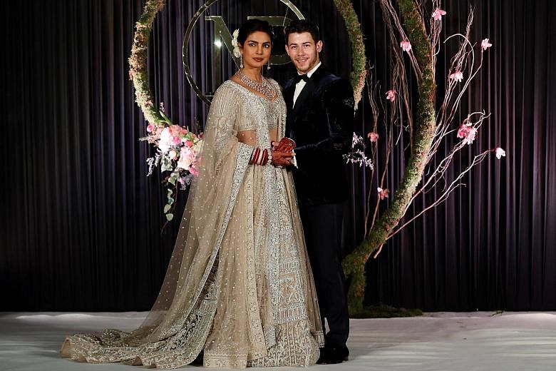 Priyanka Chopra and Nick Jonas at their wedding reception in New Delhi (above) and at their wedding ceremony on Sunday (left).