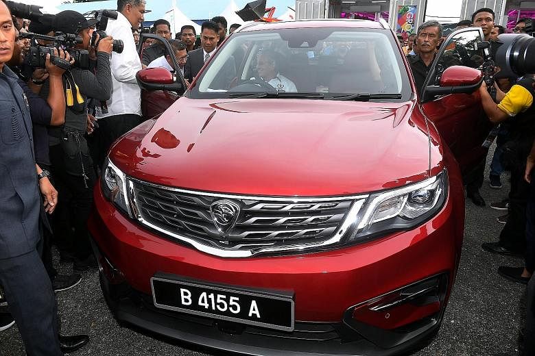 Malaysian Prime Minister Mahathir Mohamad on Nov 22 driving the new Proton X70 after visiting and officially opening the Malaysia Agriculture, Horticulture and Agrotourism Show at the Malaysia Agro Exposition Park Serdang in Selangor. The Geely-devel