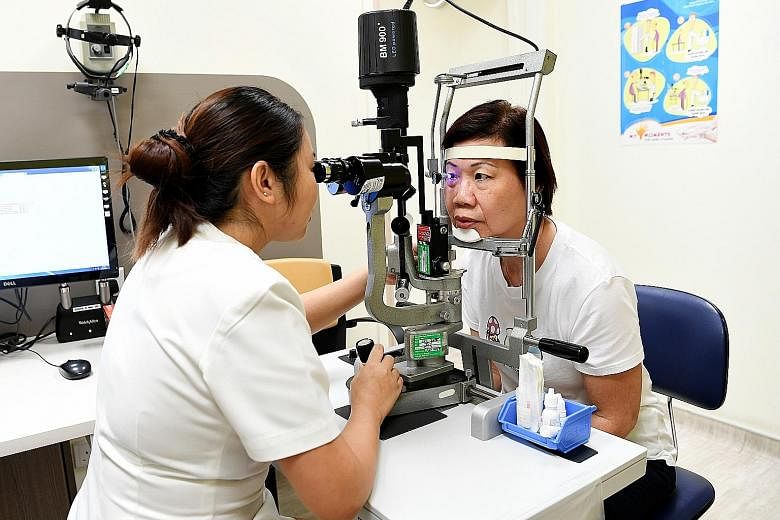 Senior staff nurse Joanne Ng checking a patient's eye pressure at the SNEC clinic. The virtual clinic has cut down waiting time for low-risk patients by calling them with test results and scheduling appointments.