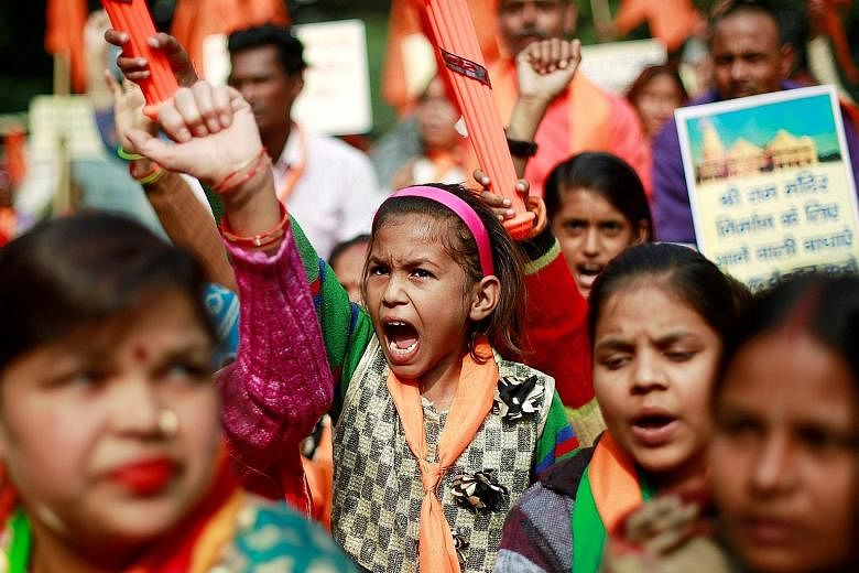 Protesters at a demonstration organised by the hardline United Hindu Front group to mark the 26th anniversary of the razing of the 16th-century Babri mosque in the city of Ayodhya in Uttar Pradesh.