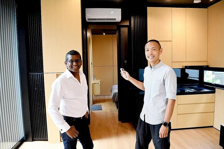 Buyers can customise the size of Movit homes. Pod Structures' chief executive officer Samuel Vedanaigam and chief operating officer Lee Kay Lian (above) at a Movit home, which comes with air-conditioning and a basic kitchen as well as a toilet .