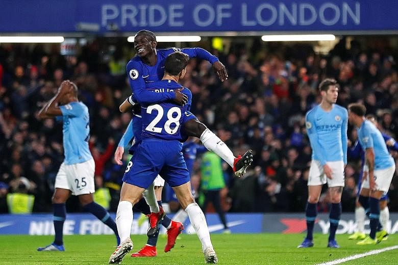 N'Golo Kante celebrating with Cesar Azpilicueta (No. 28) after he scored Chelsea's first goal during Saturday's match against City.