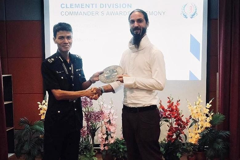 Mr Henry Antoine Nicolas Sebastien receiving the Public Spiritedness Award from Assistant Commissioner of Police Jarrod Pereira, Commander of Clementi Police Division, at a ceremony last Friday.