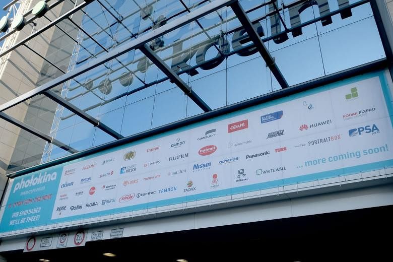 A banner outside the Koelnmesse Hall, where photo trade show Photokina 2018 took place this Sept, showing the exhibitors of Photokina 2019. The event has since been postponed to May 2020. ST PHOTO: TREVOR TAN