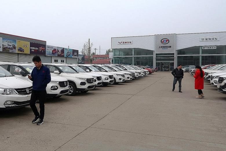 A car dealership in Henan, China. Retail sales of cars in China dived 18 per cent to 2.05 million units last month, falling for the sixth consecutive month. For the first 11 months of this year, car sales have fallen 4.3 per cent. The market is expec