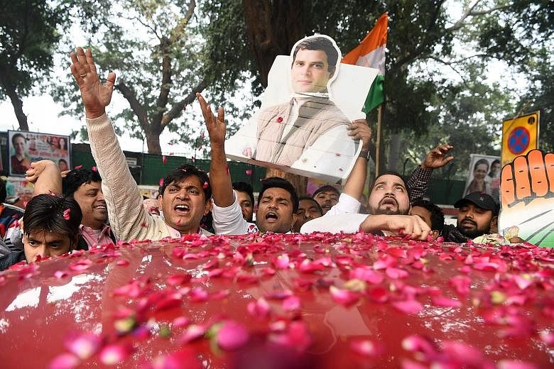 Supporters carrying a cutout of Congress party leader Rahul Gandhi, for whom the result in the latest polls has been a major boost. He had been struggling to prove his mettle in politics, suffering repeated electoral defeats in previous state electio