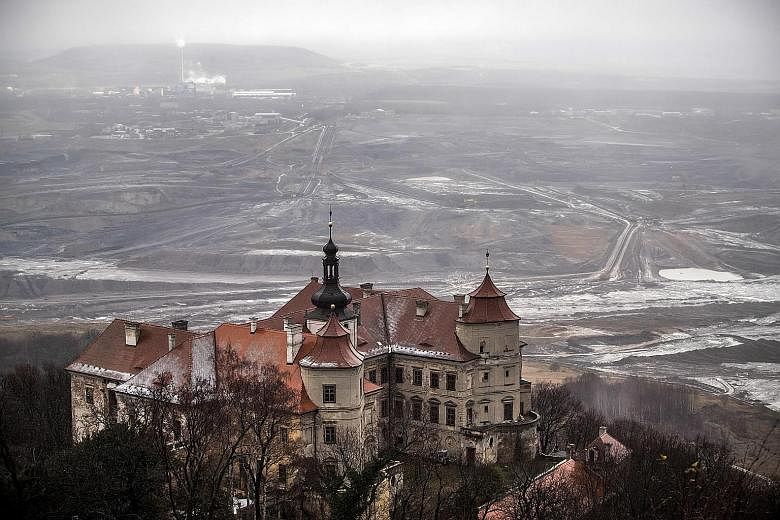 An open brown coal mine behind Jezeri Castle in the Czech Republic on Tuesday. In neighbouring Poland, where the UN climate change talks are being held, Singapore Minister for the Environment and Water Resources Masagos Zulkifli acknowledged that put