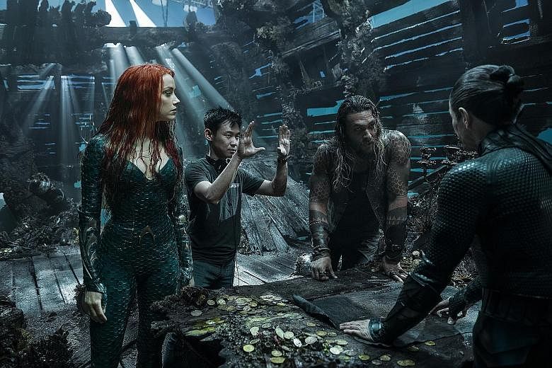 Aquaman director James Wan (second from left) on set with stars Amber Heard and Jason Momoa.