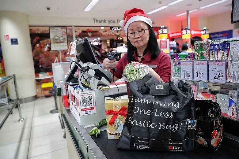 Under the One Less Plastic campaign, shoppers who spend more than $50 at participating supermarkets can redeem a reusable bag for groceries.
