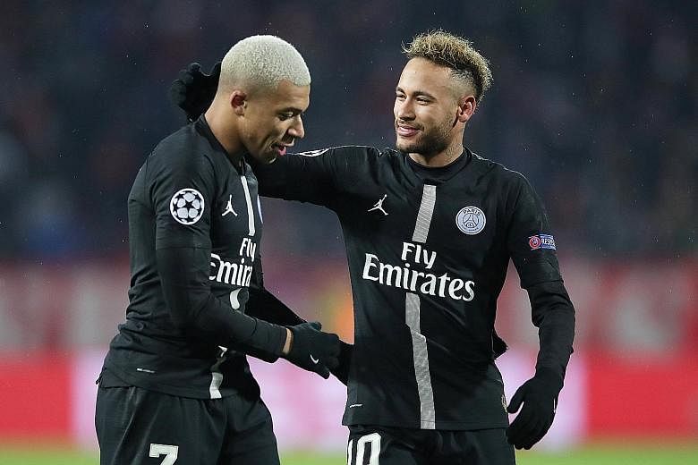 Paris Saint-Germain scorers Kylian Mbappe (left) and Neymar celebrate after their 4-1 Champions League win over Red Star Belgrade.