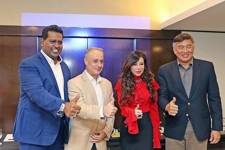 From left: Sheik Alau'ddin, the world championship's organising chairman; Mohit Lalvani, CEO of 1 Play Sports; entrepreneur Grace Kong; and Lim Teck Yin, CEO of Sport Singapore, giving the event the thumbs up.