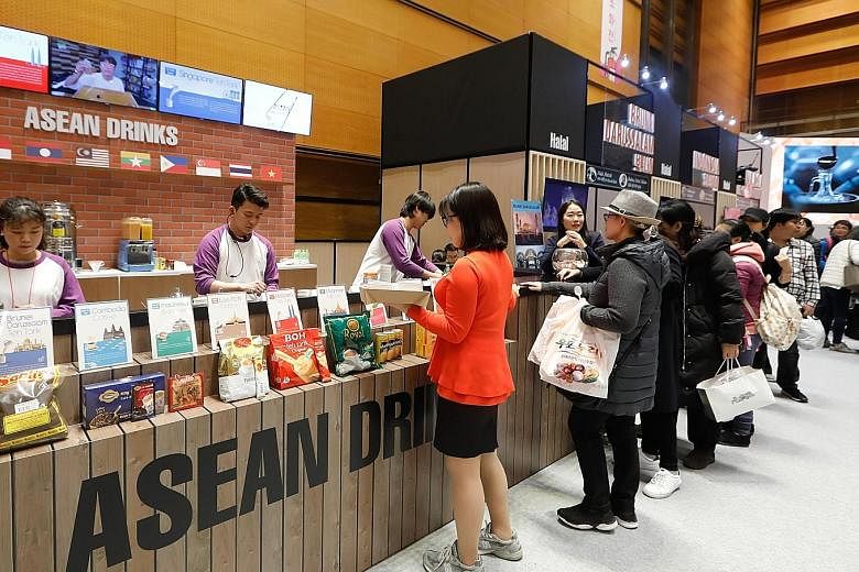 Visitors lining up to sample beverages at the third Asean Culinary Festival, organised by the Asean-Korea Centre and held from Nov 28 to Dec 1 in Seoul. Next year will see more opportunities for cooperation, with Asean and South Korea marking 30 year