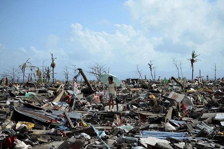 The aftermath of Super Typhoon Haiyan in Tacloban, in 2013, which left more than 7,000 people dead or missing across the central Philippines. The Permian-Triassic mass extinction on Earth that wiped out marine life millions of years ago may parallel 