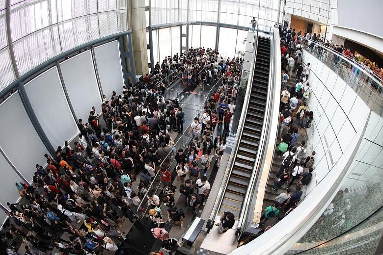 The crowd waiting to enter the Anime Festival Asia at the Suntec Singapore Convention and Exhibition Centre on Dec 1.