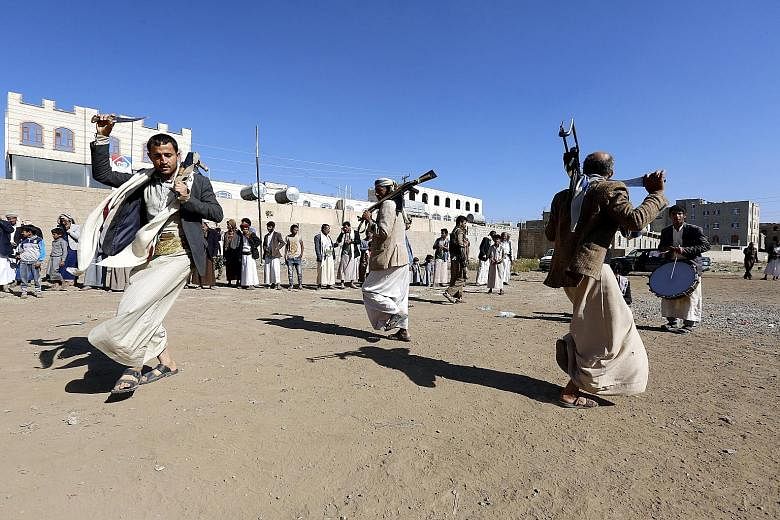 Supporters of the Houthi rebels performing a traditional dance at a gathering in Sanaa, Yemen, on Thursday. The Houthis and the Saudi-led coalition have agreed to withdraw their forces from the port city of Hodeida.