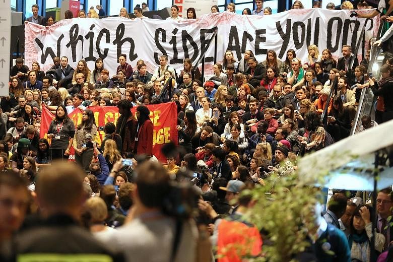 A rally by environmental groups being held alongside the UN climate talks in Katowice, Poland, on Friday. Delegates at the two-week talks were tasked with completing a complex rule book that would allow the 2015 Paris climate agreement to go into act