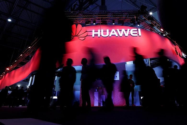 Huawei's booth at the Mobile World Congress in Barcelona, Spain, last year. The company, whose founder has a strong military background, views itself as being in a war with all of its competitors, says a management consultant.