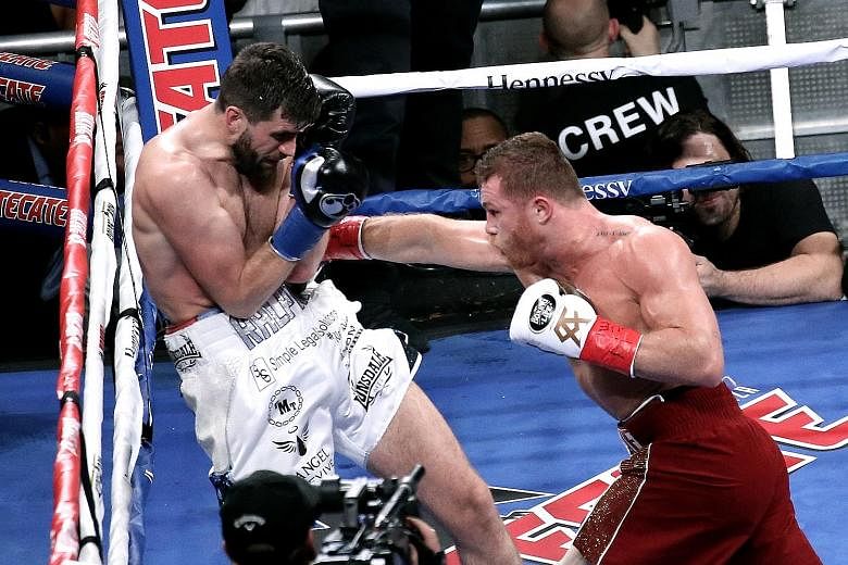 Multiple world champion Saul Alvarez from Mexico landing a right on the body of Briton Rocky Fielding in their WBA super middleweight bout at Madison Square Garden on Saturday. The referee stopped the fight in just eight minutes.