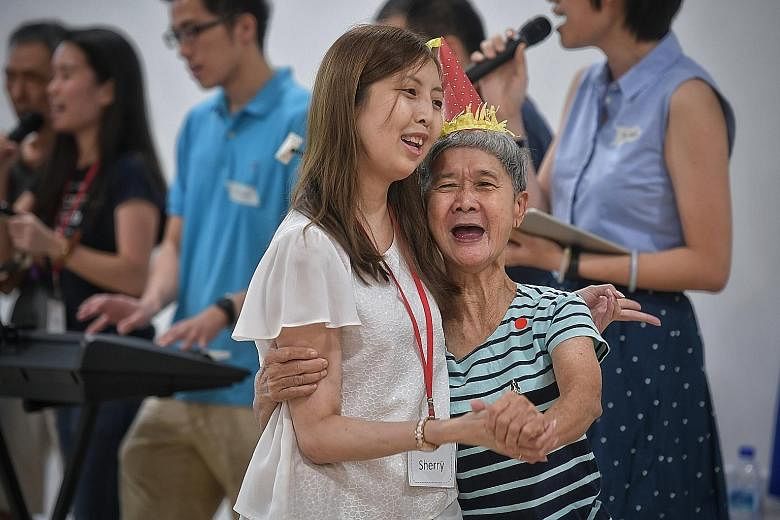 Ms Sherry Soon, who set up Be Kind SG last year, with 69-year-old How Shap Nooi, a resident of a home that the group visits.
