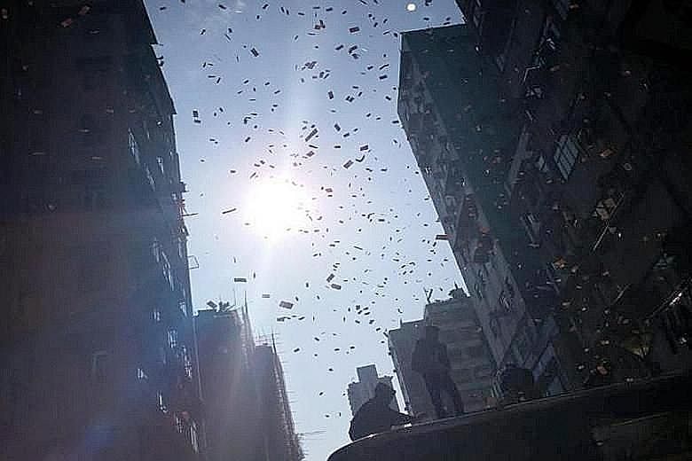 Videos posted online suggest that the notes were thrown from the roof of a building onto Fuk Wa Street in Sham Shui Po, Hong Kong, last Saturday.