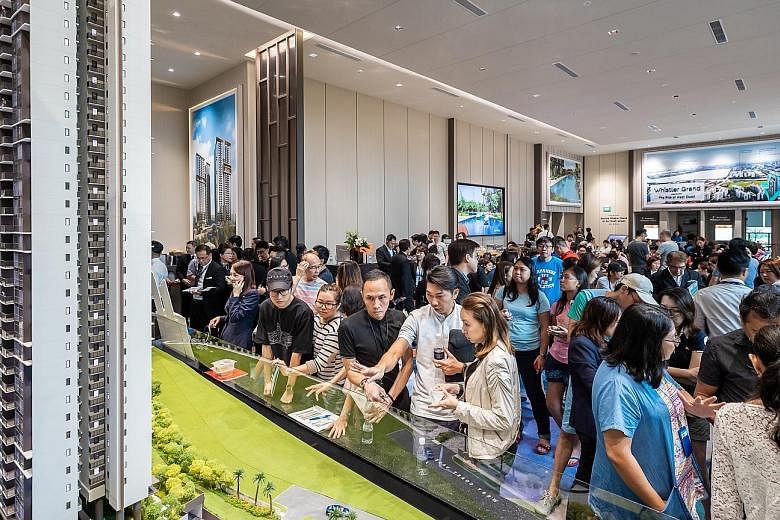 Visitors at the launch of city-fringe development Whistler Grand last month. The seven new launches - 3 Cuscaden, Arena Residences, Belgravia Green, Kent Ridge Hill Residences, The Woodleigh Residences, Parc Esta and Whistler Grand - accounted for 69