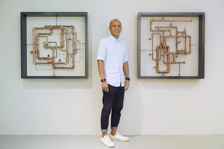 Sound artist Zul Mahmod with his work, Resonance In Frames, a three-part installation where solenoids hammer away at copper pipes, starting out with a series of sharp, rhythmic clanks.