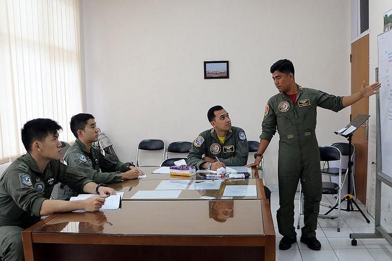 Above: RSAF and TNI AU personnel conducting mission planning together before the flight. Left: The RSAF's F-16C and TNI AU's Hawk 209 taking part in a mission during Exercise Elang Indopura 2018.