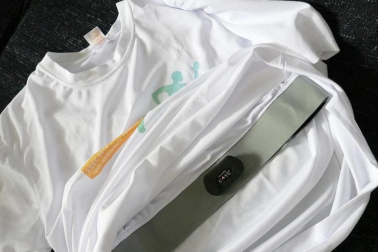 Underneath the loose-fitting exterior of the Smart Fitness T-shirt is an inner layer housing the Bluetooth module and printed carbon electrodes.