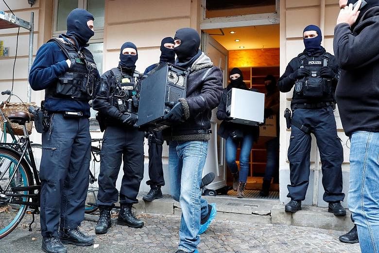 Policemen in Berlin searching As-Sahaba mosque, where the cleric Abul Baraa preaches. He is suspected of sending money to an Islamist fighter in Syria "for purchasing military equipment", according to the General Prosecutor's Office. The mosque is sa