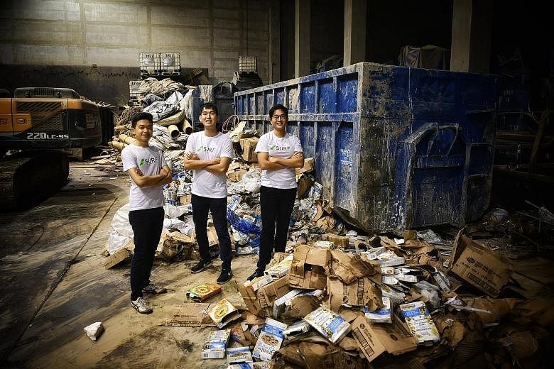 NTU undergraduates (main picture, from left) Ang Wei Loong, Wong Song Wei and Lek Zhi Yu created an app (left) that uses a points system to encourage people to recycle. They also started a company, Surf, to run recycling drives in firms.