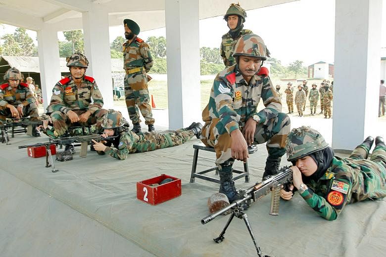 Female Afghan army cadets at a target-shooting practice session yesterday at the Officers Training Academy in the south Indian city of Chennai. A team of 19 female officers are undergoing the training, which is part of the Afghan National Army's effo